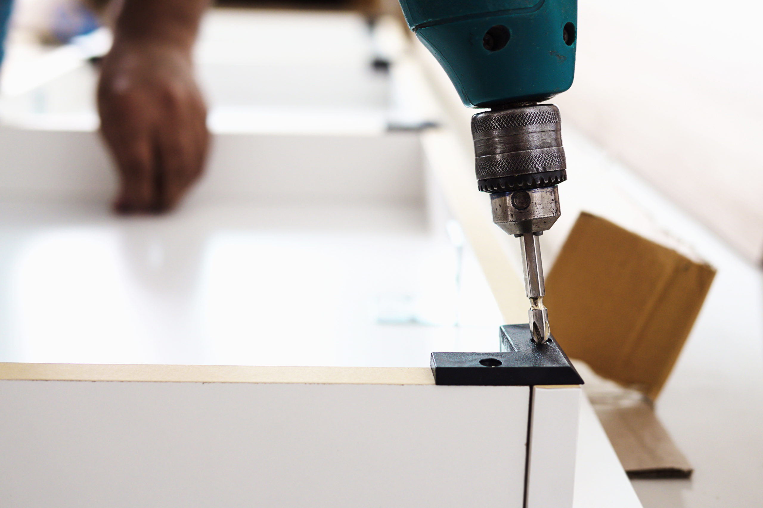 vecteezy_man-is-working-with-furniture-assembly-using-electric_8743022
